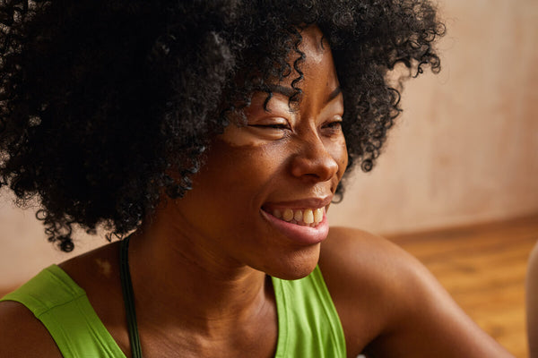 woman laughing smiling because podcast