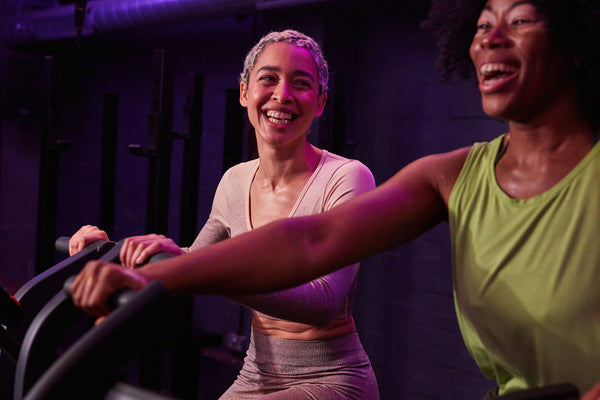 Two female friends in the gym