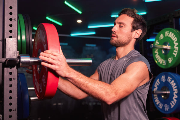 Man with weights in gym