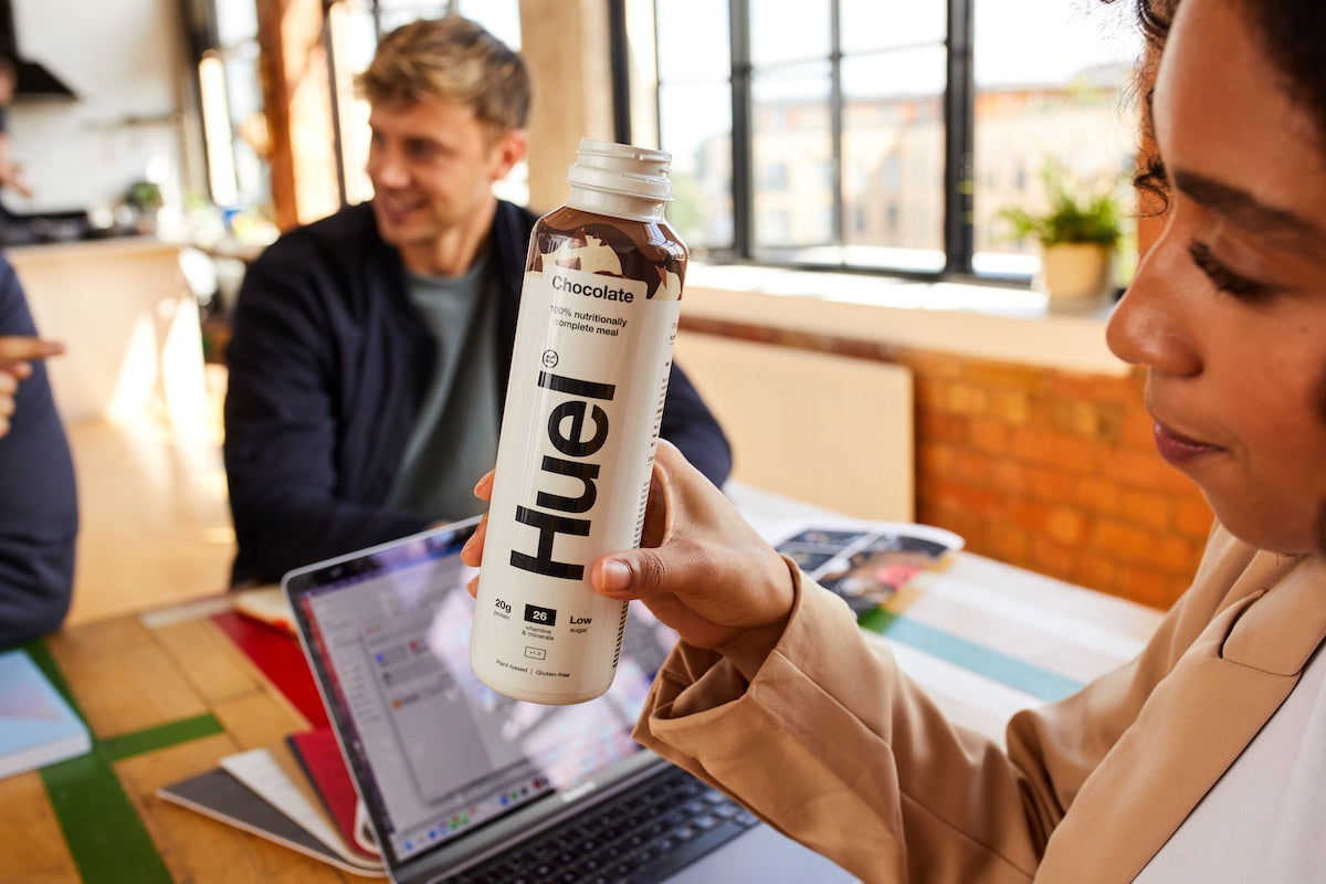 Woman drinking Huel for breakfast